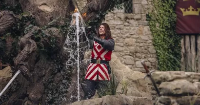 The knight Tristan removing Excalibur, the King Arthur's sword in the show "The King Arthur's Sword" in Puy du Fou